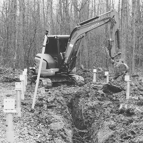 Excavator digging service lines